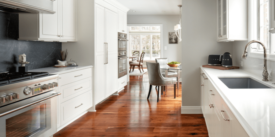 Galley Kitchen with Warm Wood Floors