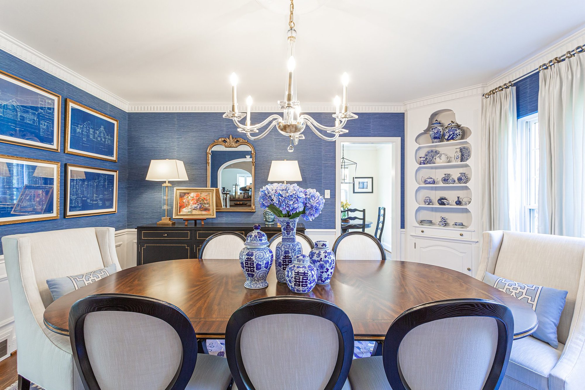 Blue and white themed dining area with painted china dishes - Payne & Tompkins - Ohio Design Build Firm - Designing a Home that Feels Like you Payne and Tompkins