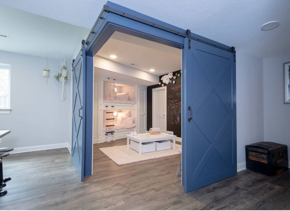 Corner Play Area in Finished Basement with Two Barn Doors in Cleveland