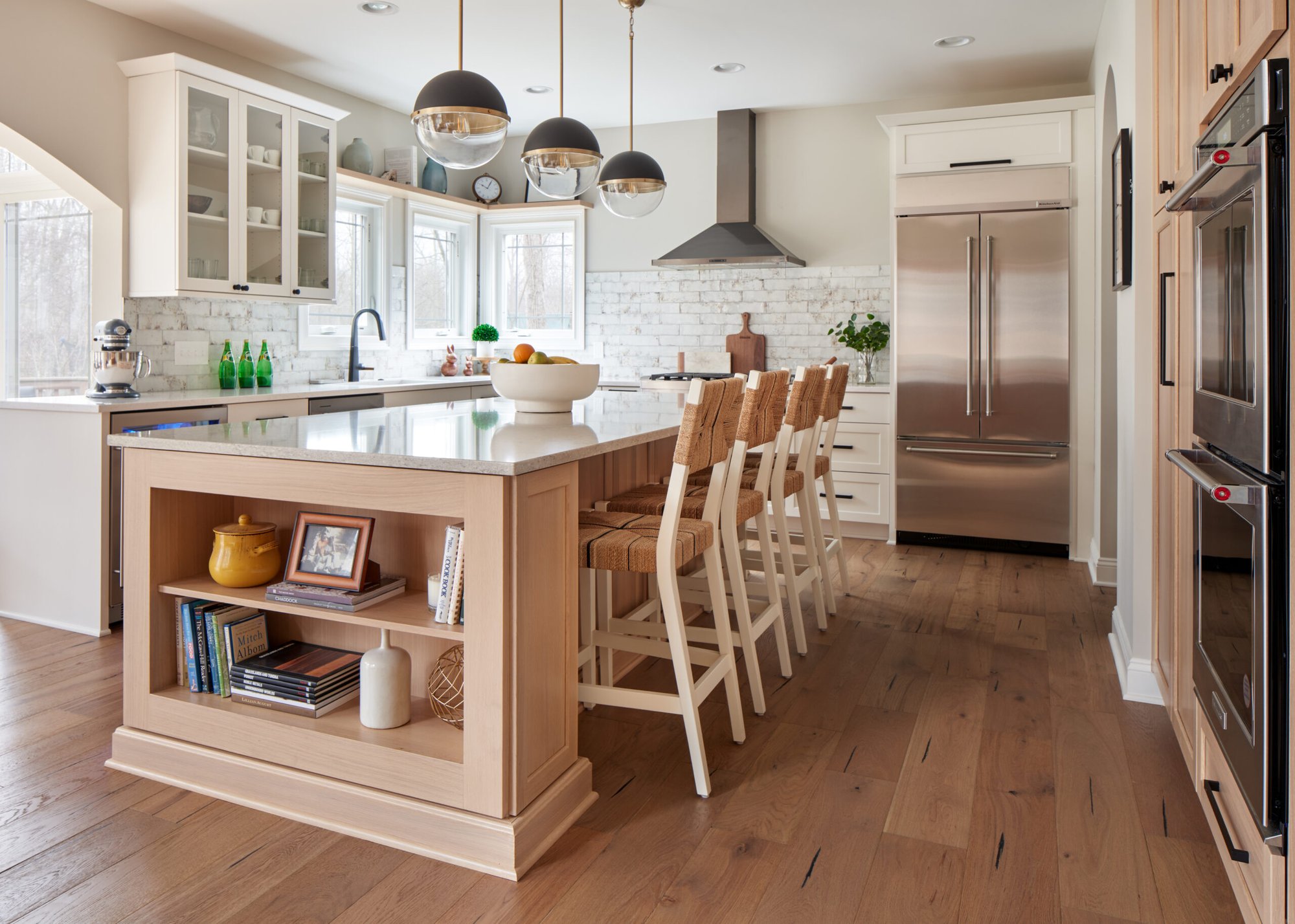 Bright airy kitchen with center island and chairs