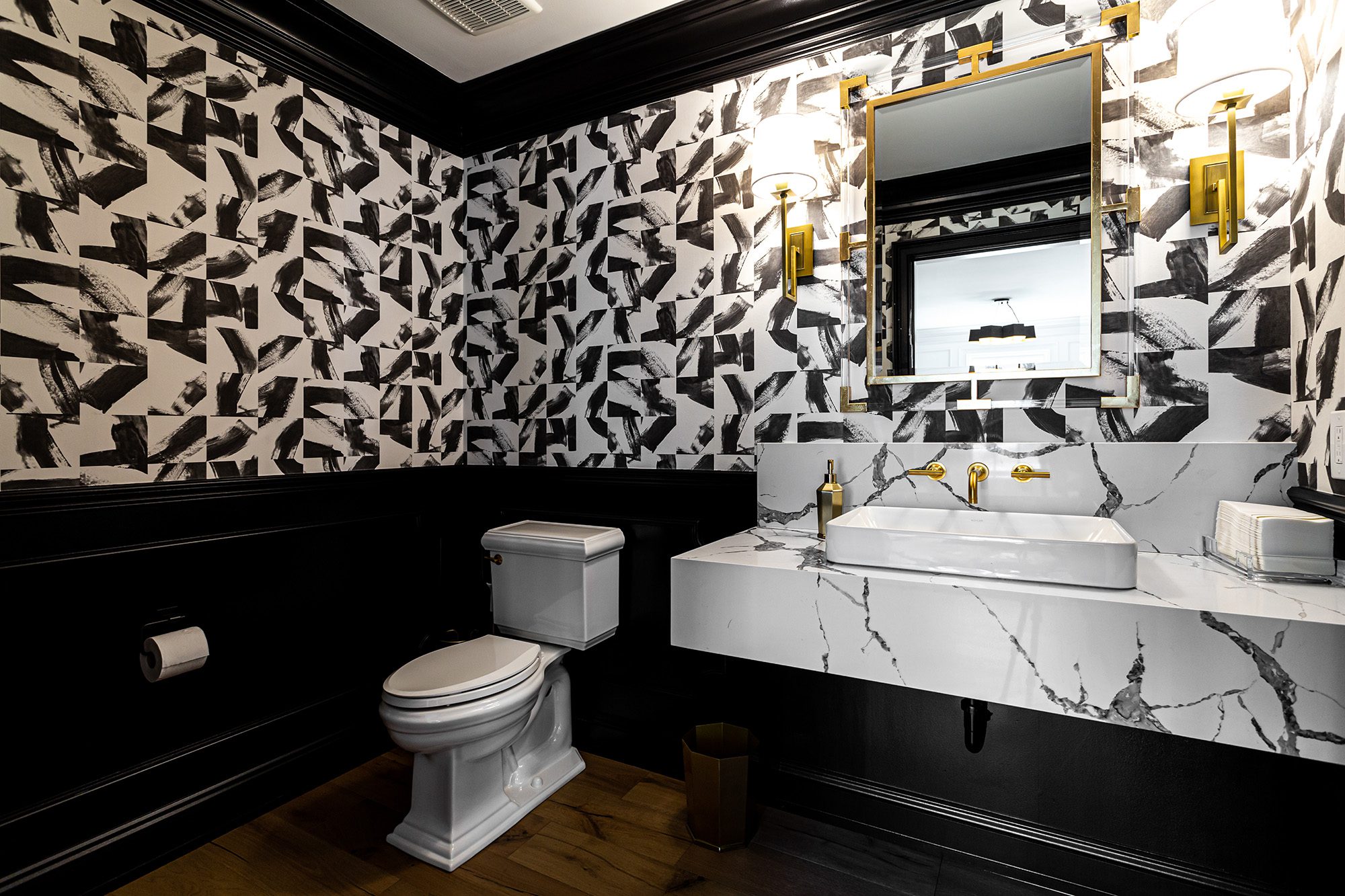 Black and white artsy wallpaper in bathroom with marble and gold finishes - Payne & Tompkins - Ohio Design Build Firm - Designing a Home that Feels Like you 