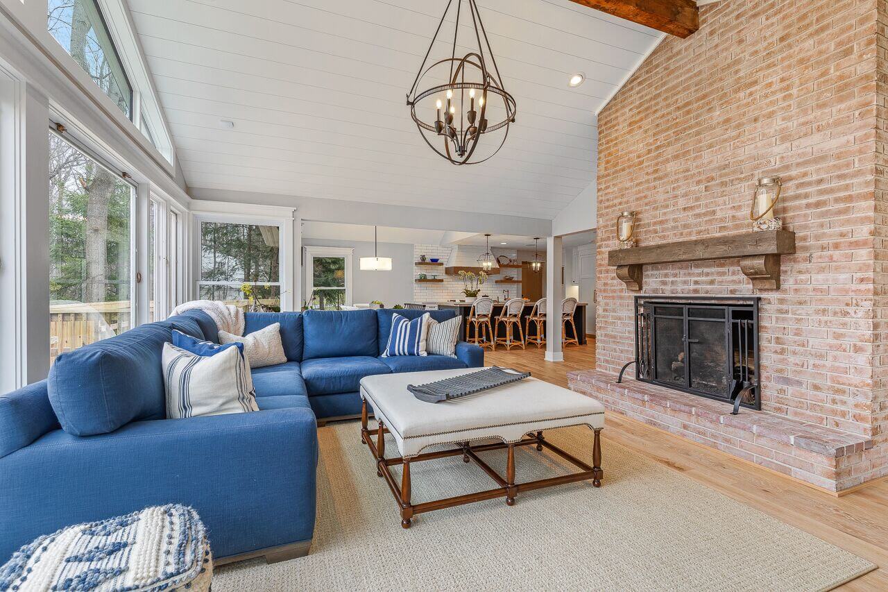 High ceiling living room with brick wall fireplace - Payne & Tompkins - Ohio Design Build Firm - Designing a Home that Feels Like you Cleveland Ohio