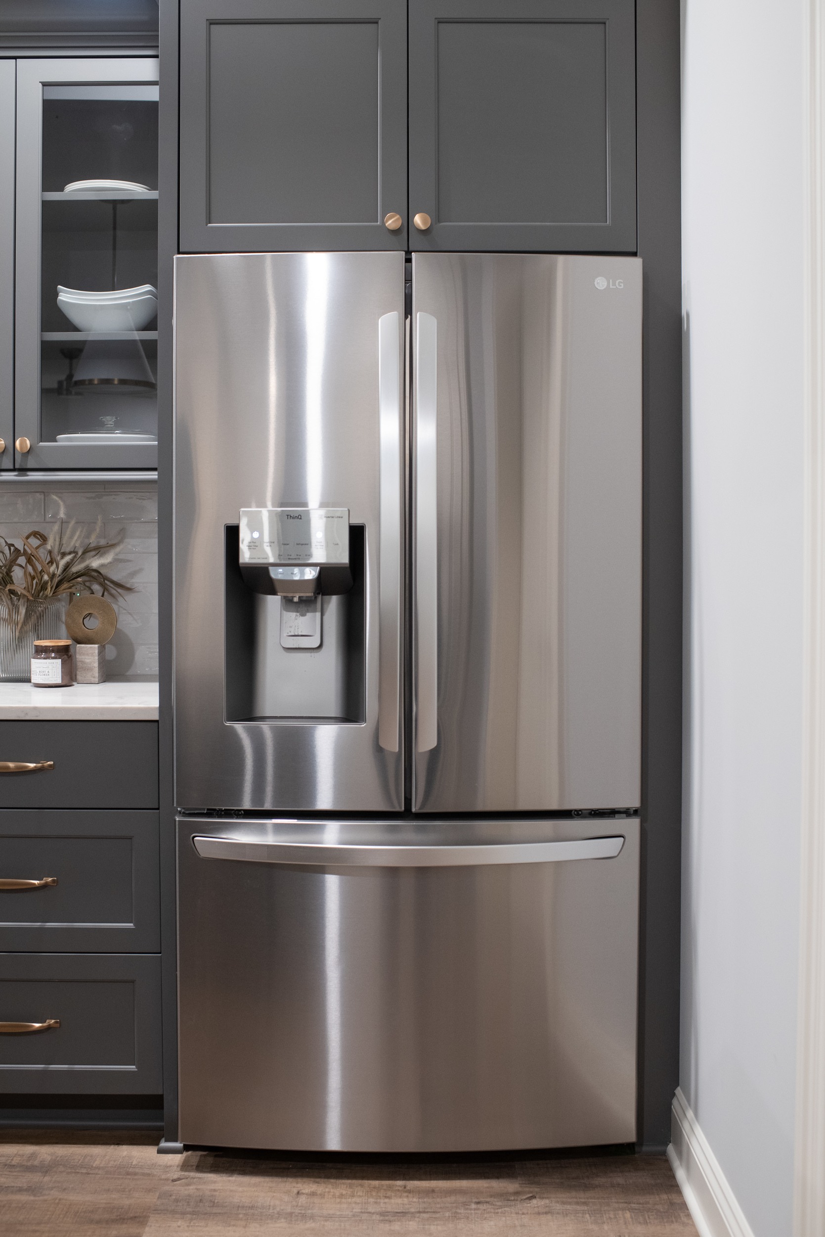 stainless steel fridge in basement