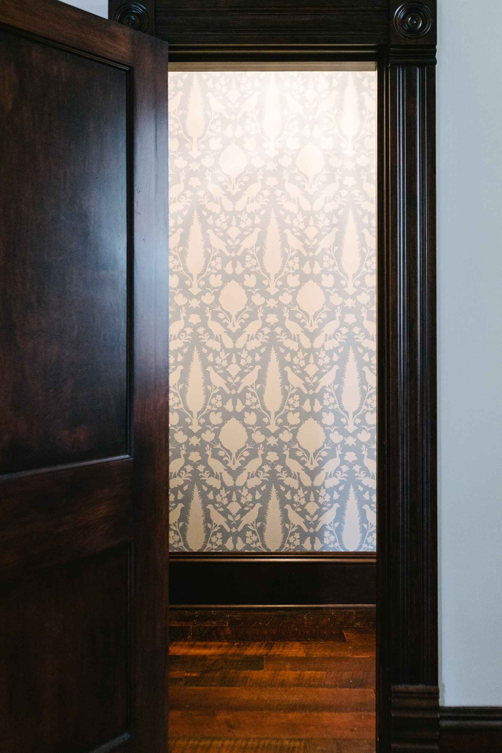 pattern wallpaper in renovated hall bath cleveland