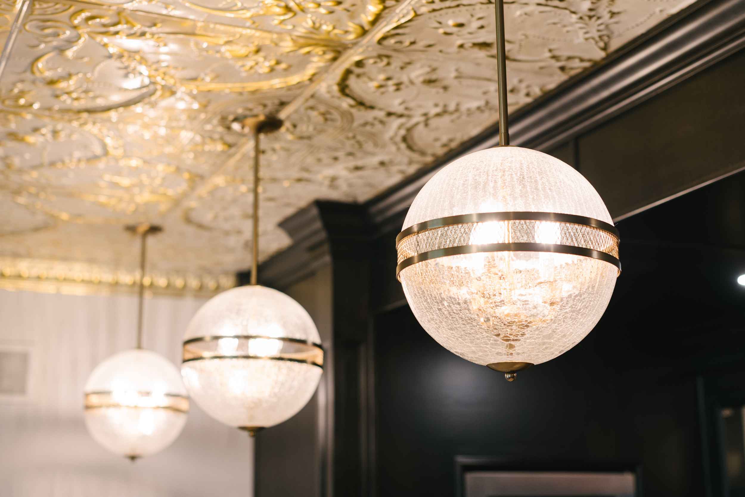 Globe pendant lights accent ceiling in cleveland basement remodel