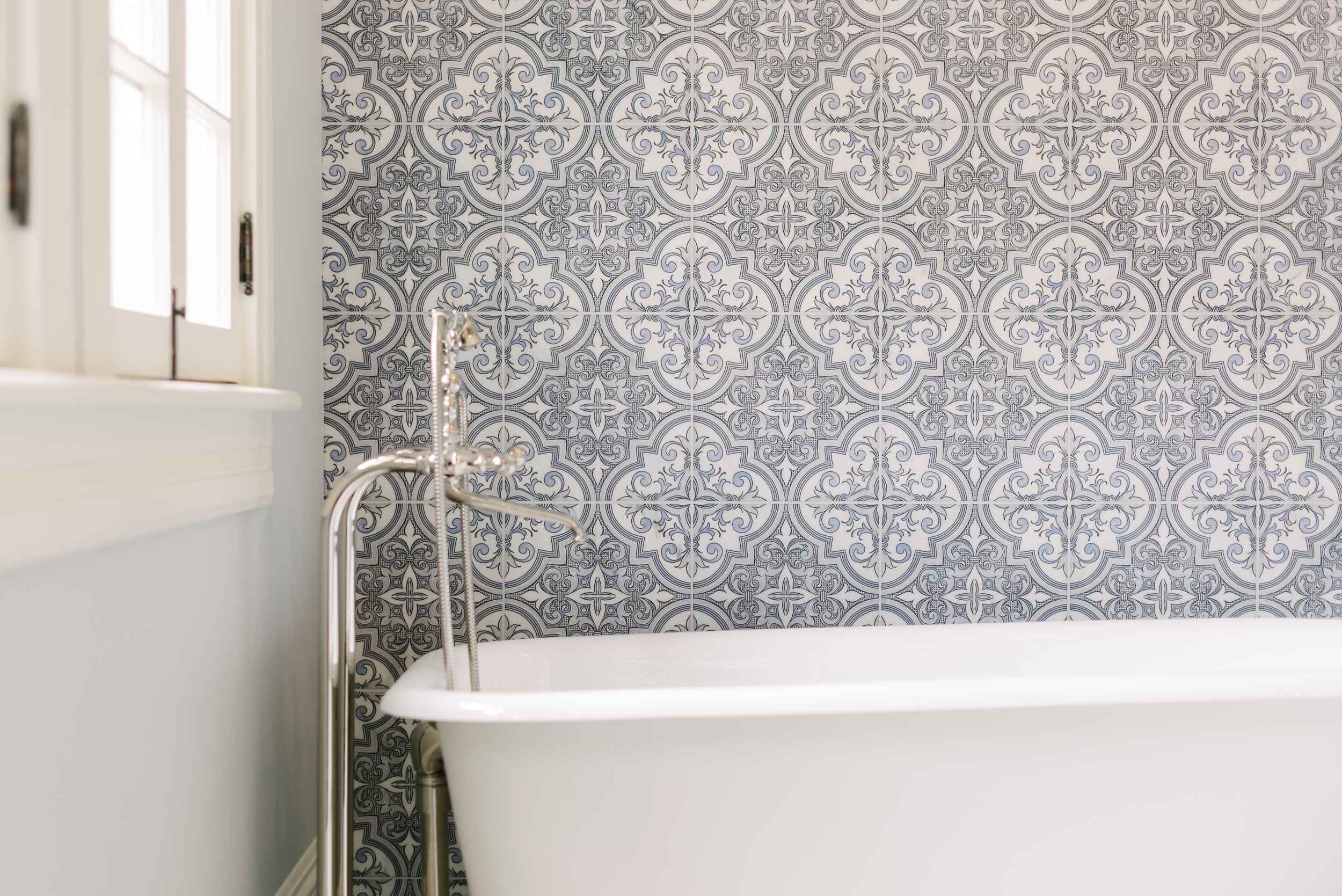 white tub with patterned wall tiles feature wall ohio remodel