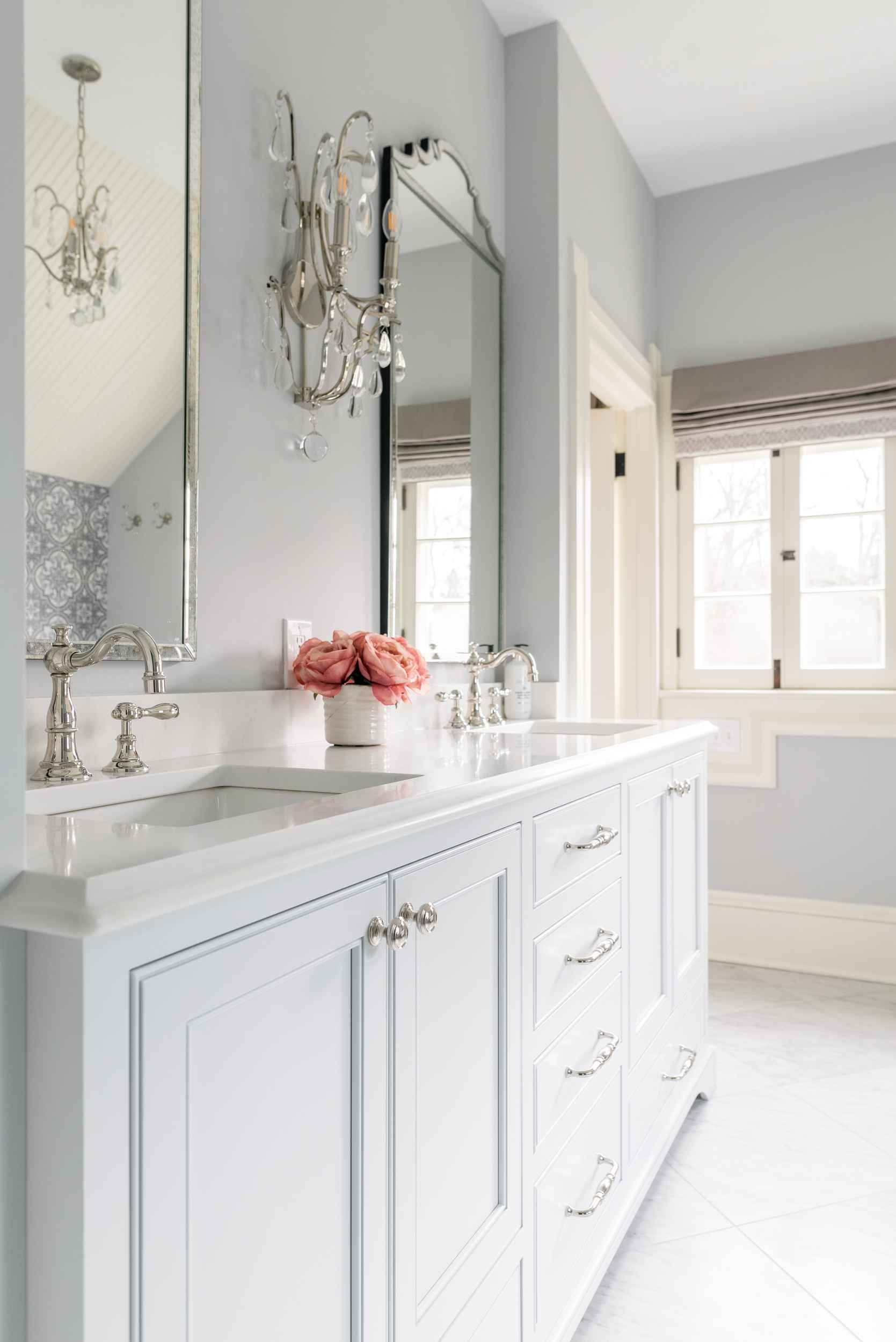 white victorian bathroom vanity with storage in remodeled ohio home