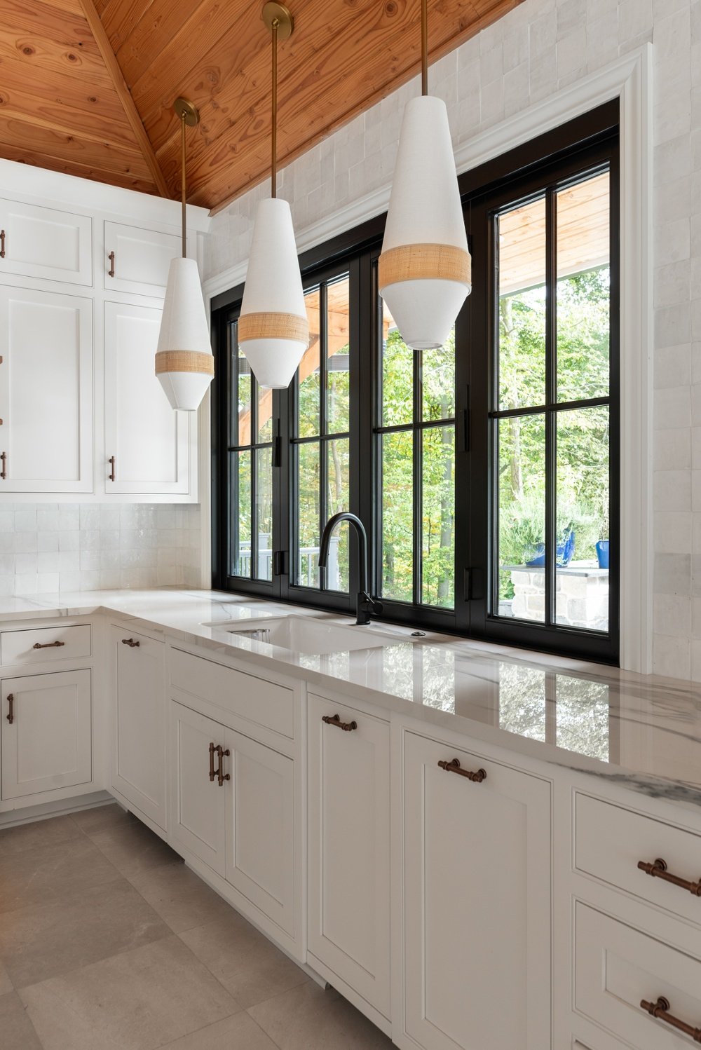 white kitchen with black window trim