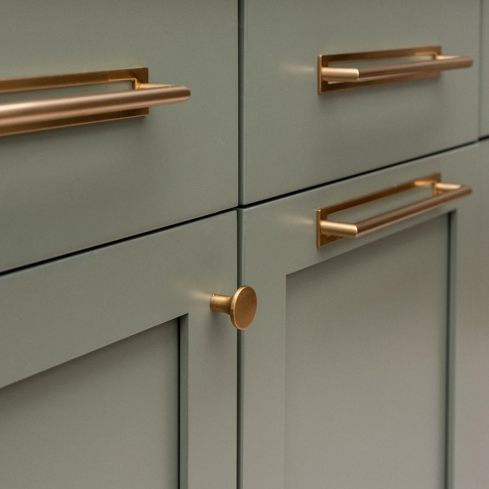green drawers with gold hardware