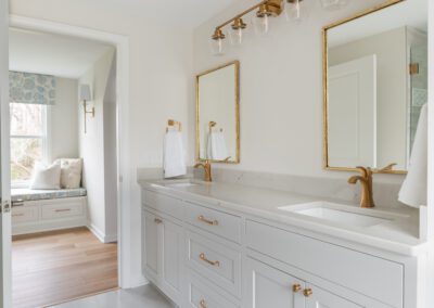 renovated white master bathroom