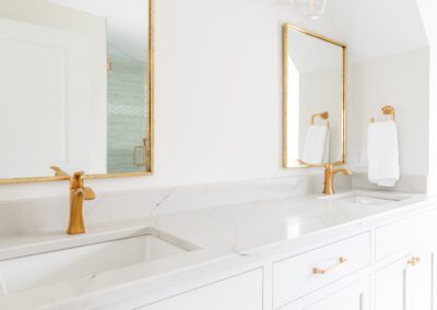 white dual sink vanity with gold accents in ohio remodel