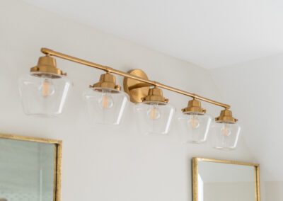 gold light fixture bathroom