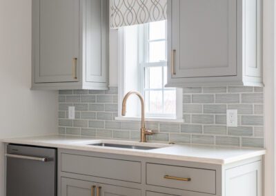 in law suite kitchen with gray backsplash