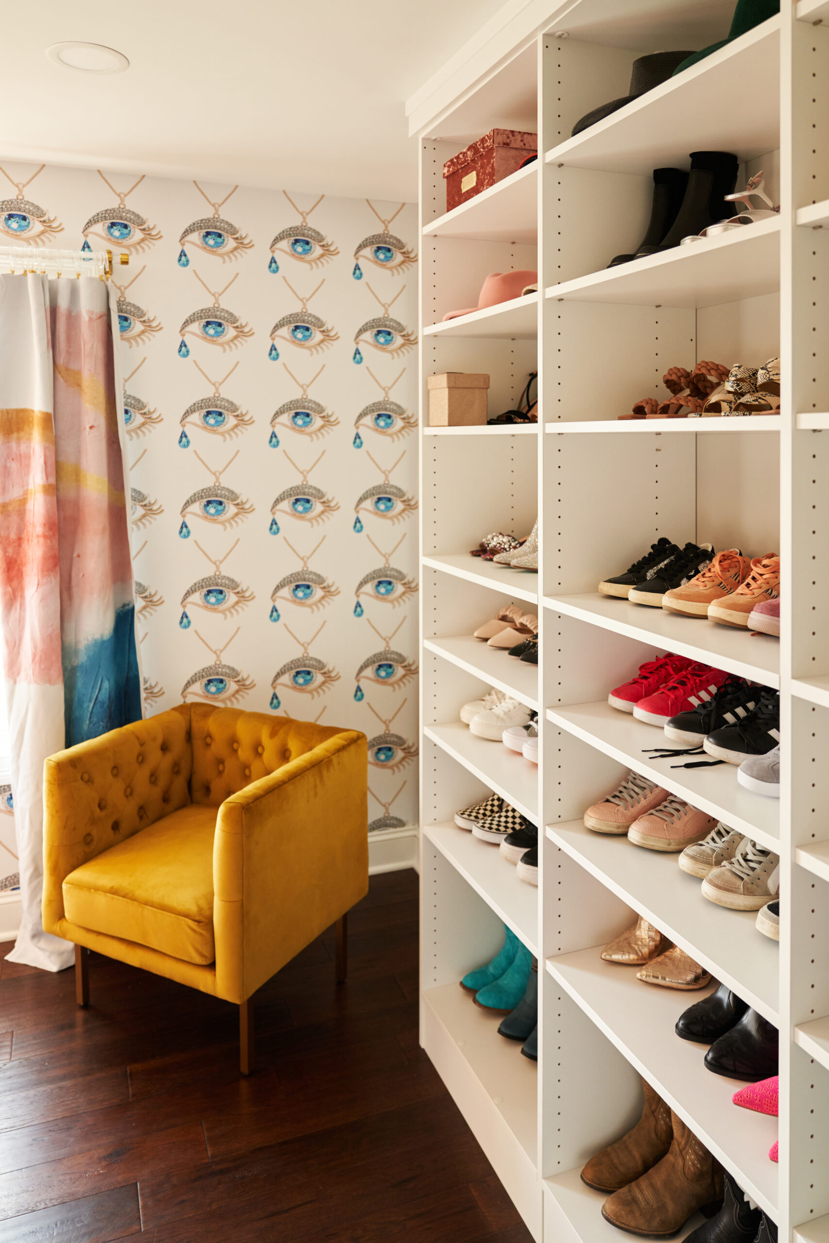 Bright Accent Chair and Graphic Wallpaper in Ohio Primary Suite