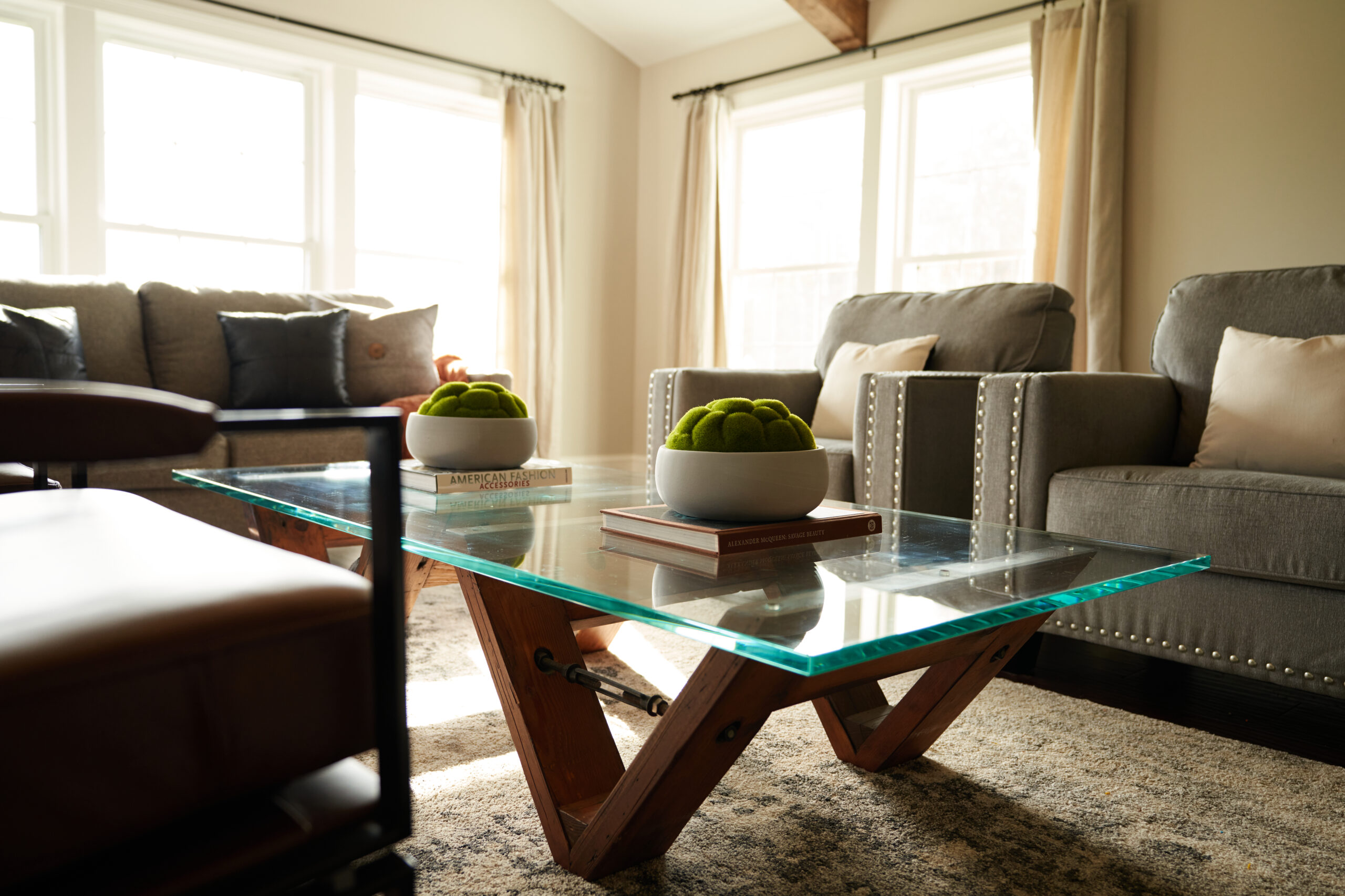 Modern Glass Coffee Table and Armchairs in Living Room Renovation