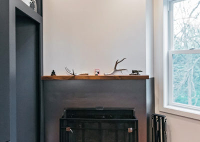 small fireplace with gray surround