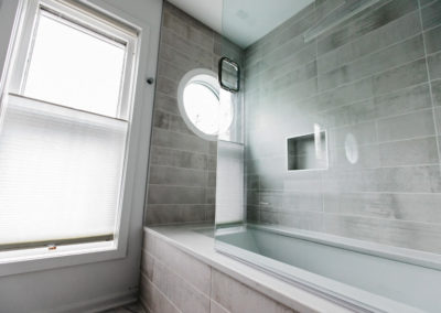 bathroom tub with glass door