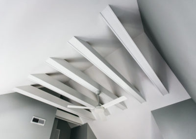 white exposed beams in vaulted ceiling