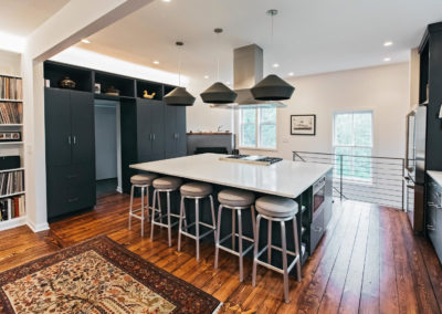 black kitchen cabinets with large seating island