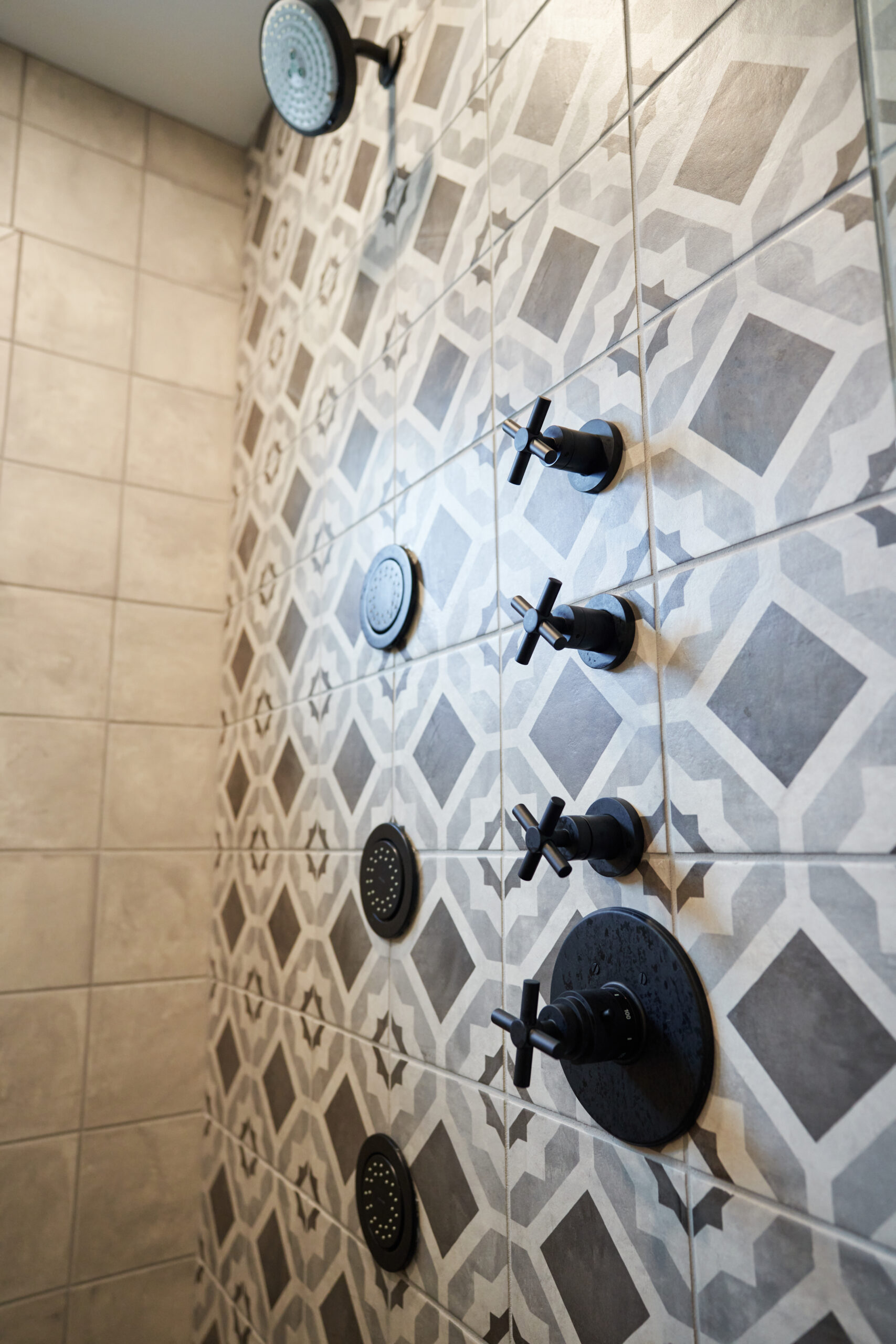 Patterned Encaustic Tile Accent Wall in Shower Renovation