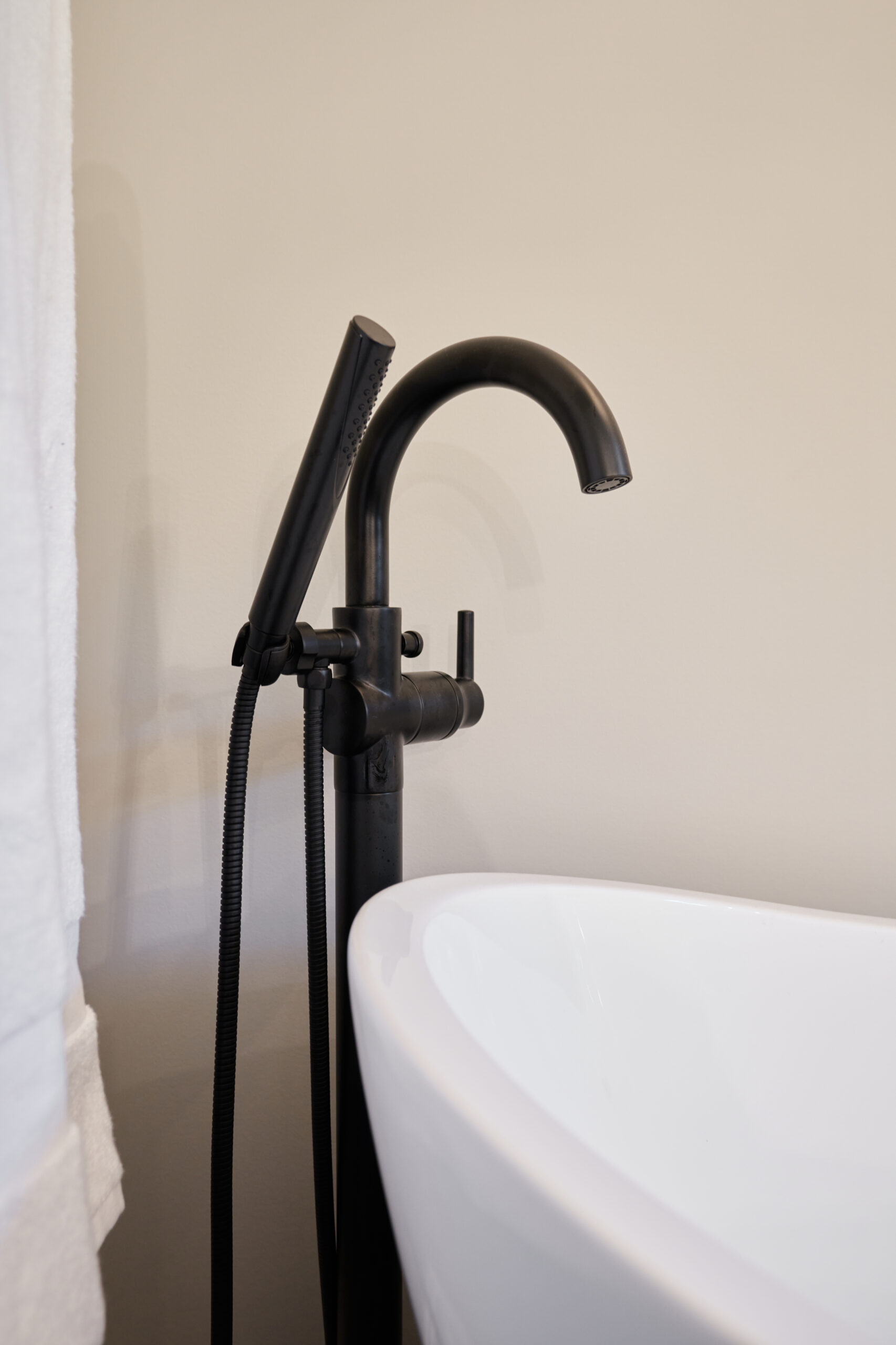 Soaking Tub with Hand Shower in Renovated Bathroom