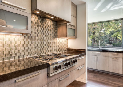 modern kitchen with gray and black backsplash