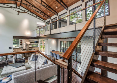 dark wood and black open staircase from living room