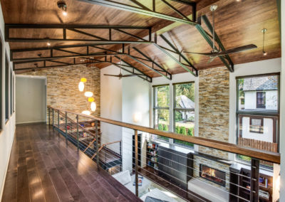 vaulted ceiling with exposed black beams