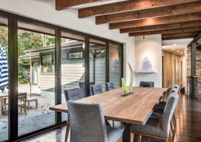 modern dining room with wood beams