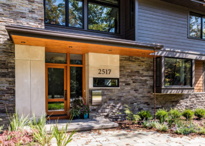 exterior of multi surface home with stone and wood accents