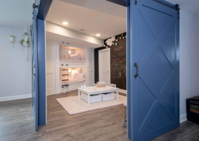 sliding blue barn doors to bunk bed room