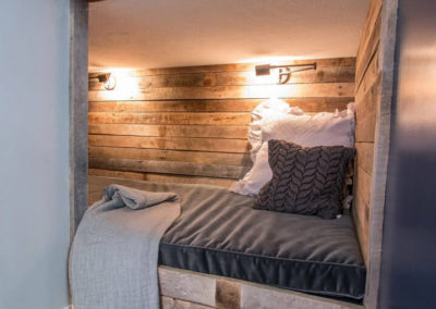 cozy nook under wood beams with wood plank surround