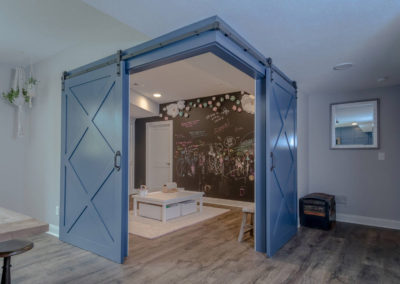 barn doors open to bunk room