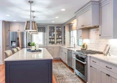 two toned gray kitchen with stainless steel appliances