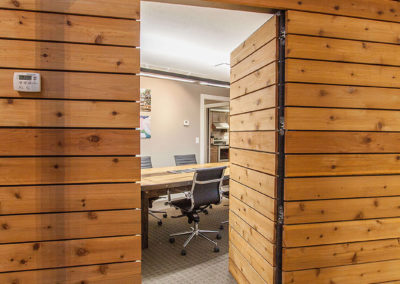 wood paneled doorway in modern office for Exscape Designs