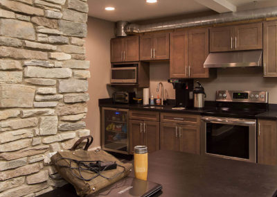 office kitchen with dark brown cabinetry