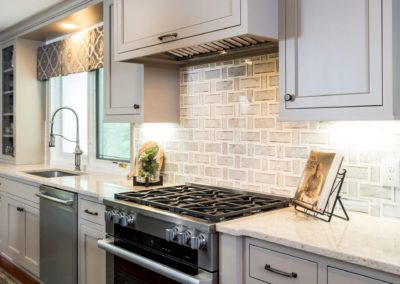 stainless steel oven and range with tile back splash