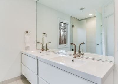 white bathroom remodel with double sink vanity