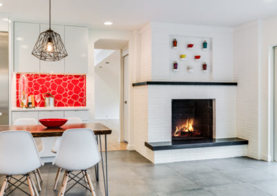 white brick fireplace in modern kitchen remodel