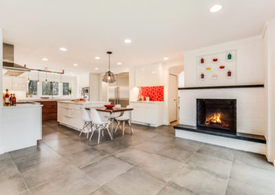 modern kitchen remodel with white brick fireplace