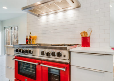 bluestar red oven and gas range in modern kitchen