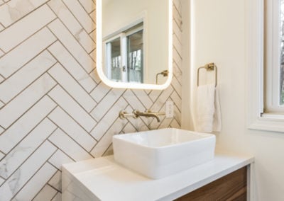 high end half bathroom remodel with wall mounted vanity
