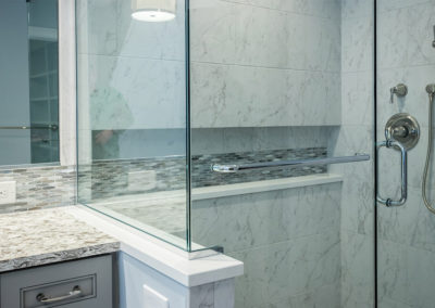 glass doors of tiled shower in master bath remodel