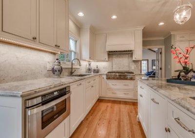 white kitchen with under cabinet LED strip lighting