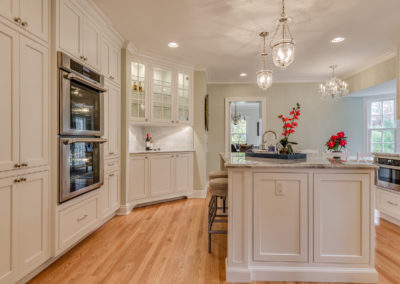 kitchen remodel with lighted hutch and glass shelves