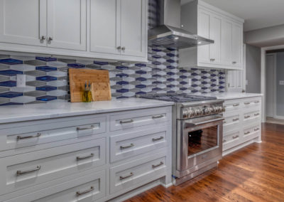 kitchen remodel with gray cabinets and patterned backsplash