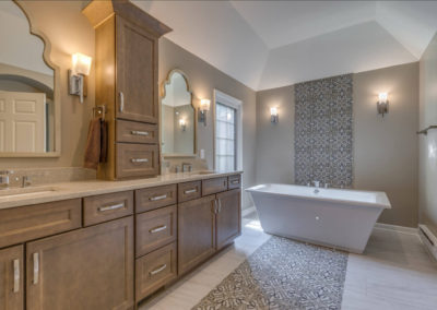 master bathroom with double sink vanity and freestanding square tub