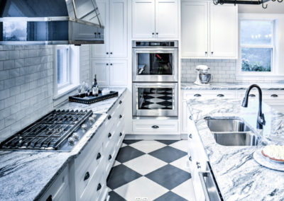 retro kitchen with black and white marbled counters