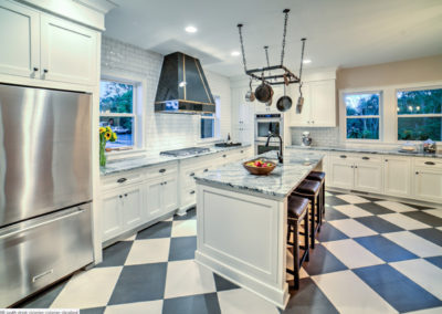 modern retro kitchen with black and white checkered floor