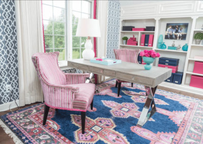 home office with navy, pink and teal color scheme